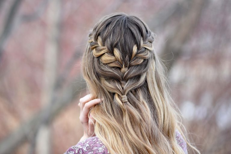 Back view of girl standing outside modeling the "Lace Half Up" hairstyle