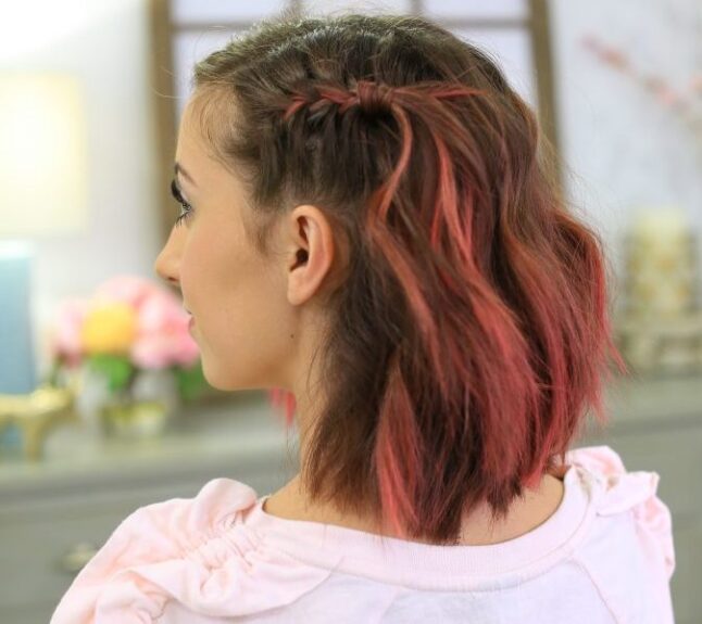 Side view with pink dyed hair indoors to modeling "Side Pull Back" hairstyle.