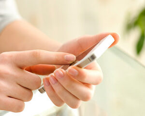 Woman texting messaging on her phone