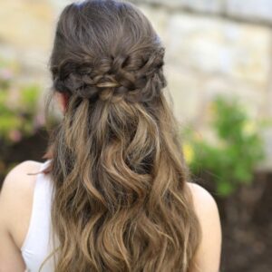 Back view of girl with long hair standing outside modeling "Braided Half Up"