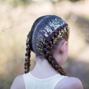 Back view of girl outside with gold glitter in her hair modeling "Dutch Glitter Braids" hairstyle