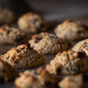 chocolate chip cookies rising on a pan