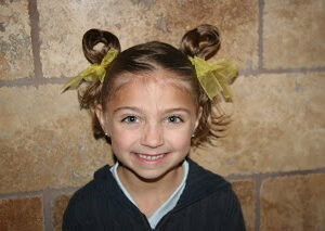 Portrait of young girl modeling Easter Hairstyles: Bunny-Ear Pigtails