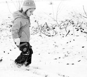 Child playing in the snow