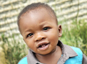 Baby boy playing outside